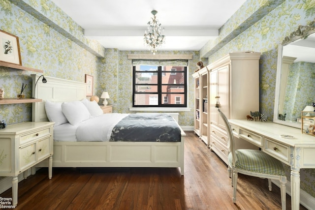 bedroom featuring dark hardwood / wood-style floors and a notable chandelier