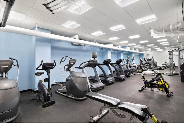 workout area featuring a drop ceiling