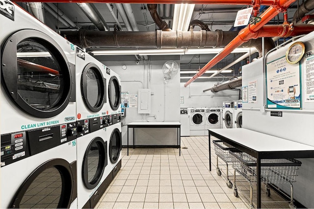 laundry room with stacked washer / drying machine and washer and dryer