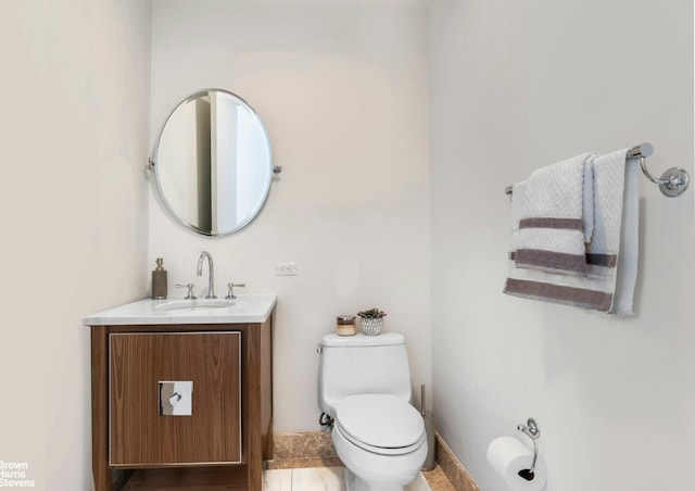 bathroom with toilet and vanity