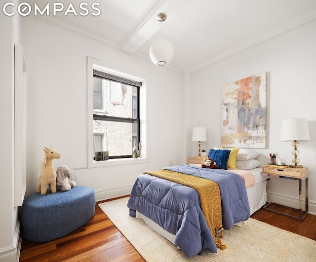 bedroom featuring crown molding and hardwood / wood-style floors