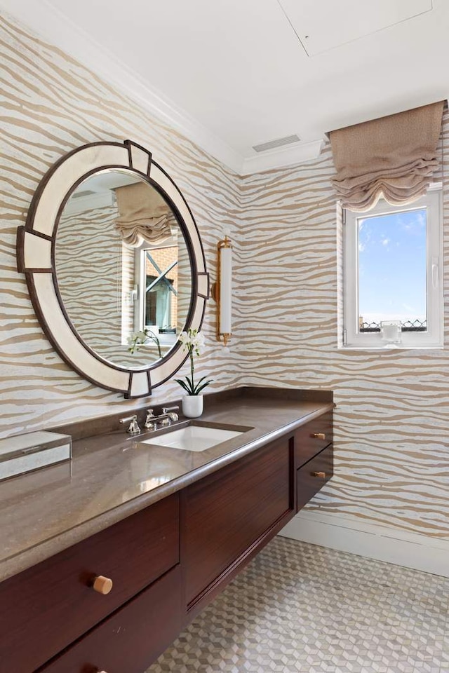 1130 Park Ave Ph-A, Ph-A New York City, NY 10128 - bathroom featuring wallpapered walls, baseboards, crown molding, and vanity