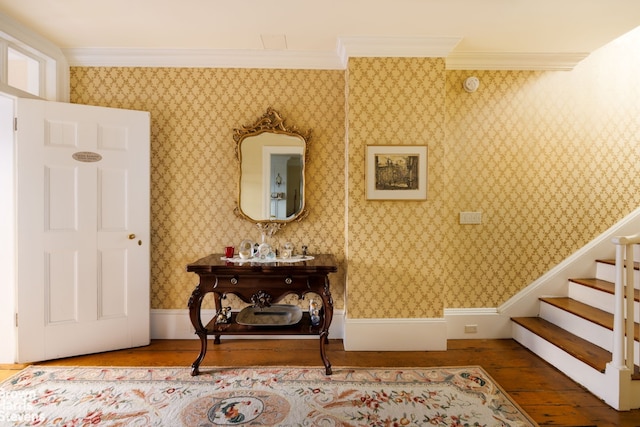 interior space with hardwood / wood-style flooring and ornamental molding