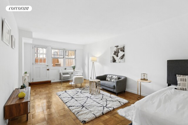 bedroom featuring light parquet flooring