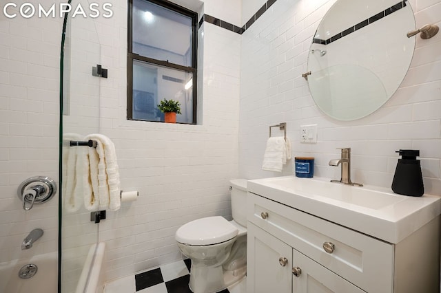 full bathroom with toilet, tiled shower / bath combo, and vanity