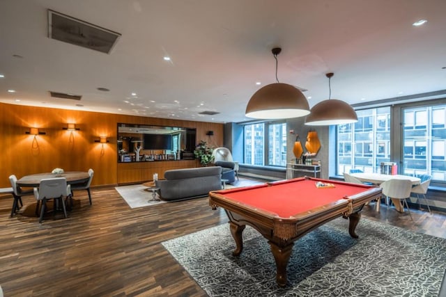 recreation room with billiards, wood-type flooring, and wooden walls