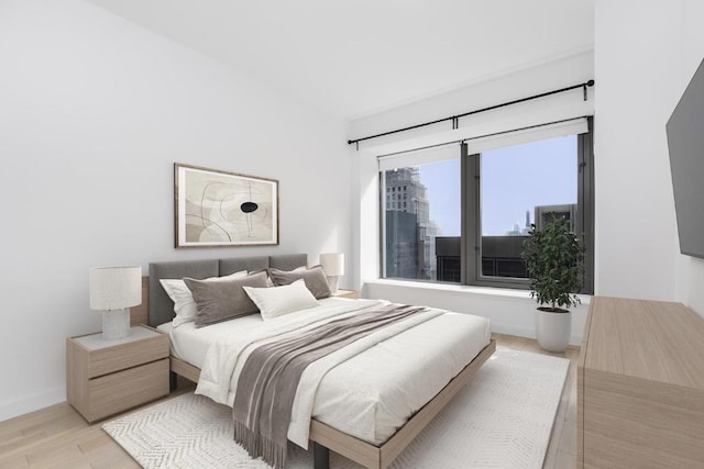 bedroom with light hardwood / wood-style flooring