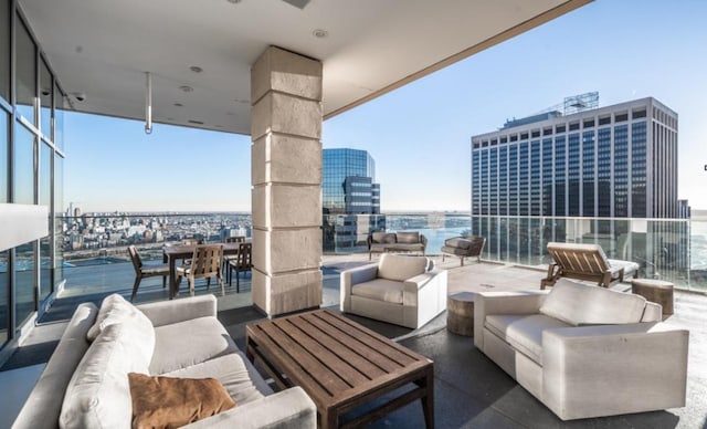 balcony with a city view and outdoor lounge area