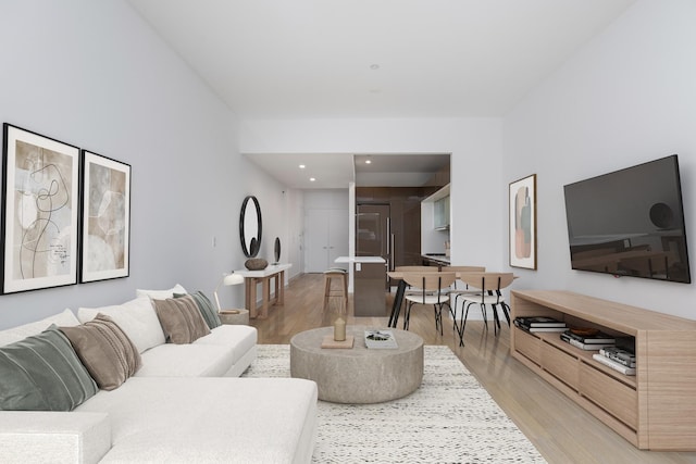 living room featuring recessed lighting and light wood-style floors