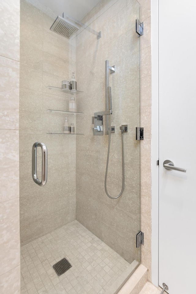 bathroom with a shower stall