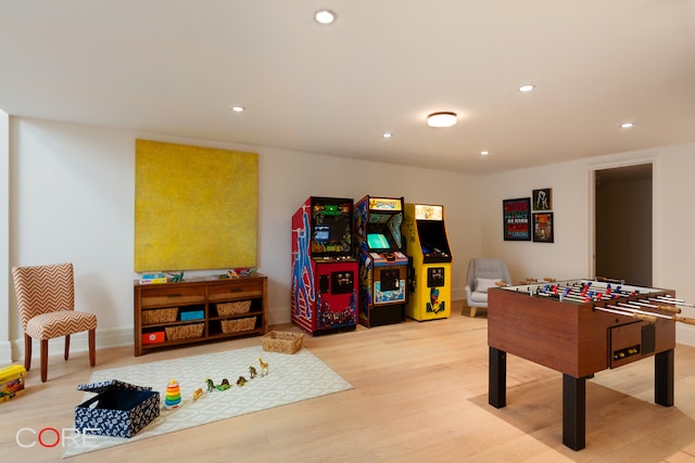 recreation room with hardwood / wood-style floors