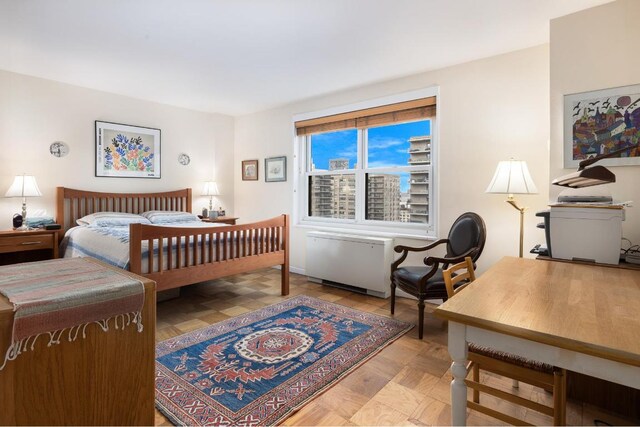 bedroom featuring light parquet flooring