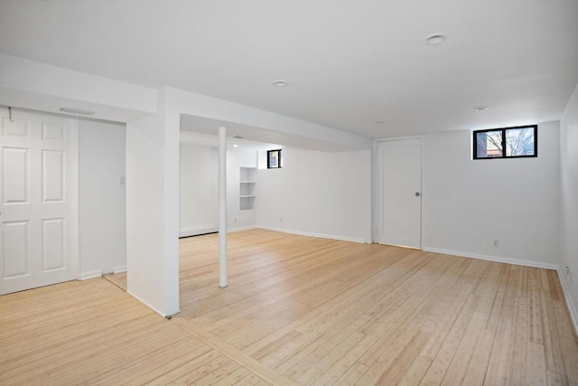 basement featuring light wood-type flooring