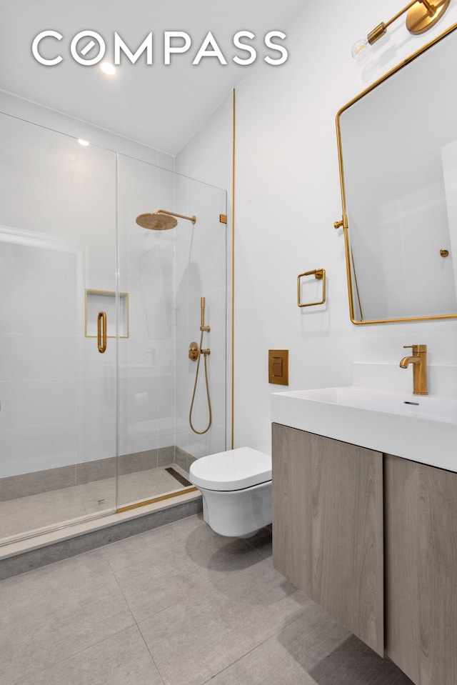 bathroom with toilet, vanity, a shower stall, and tile patterned flooring