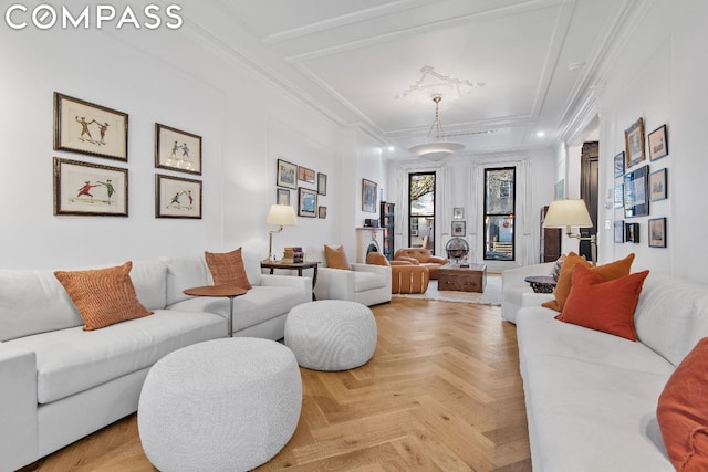 living room featuring light parquet flooring and ornamental molding