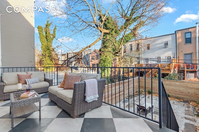 view of patio / terrace featuring an outdoor living space and a balcony