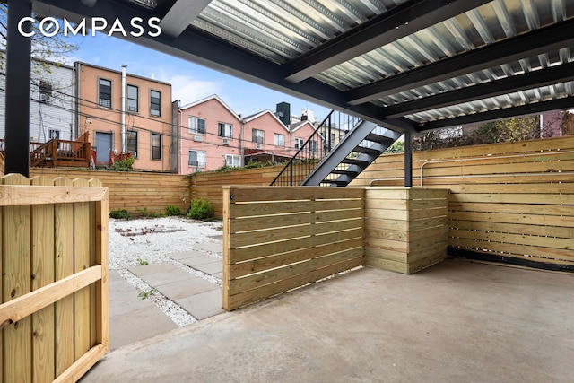 view of patio featuring stairway