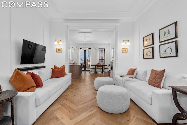 living room featuring light parquet flooring and ornamental molding