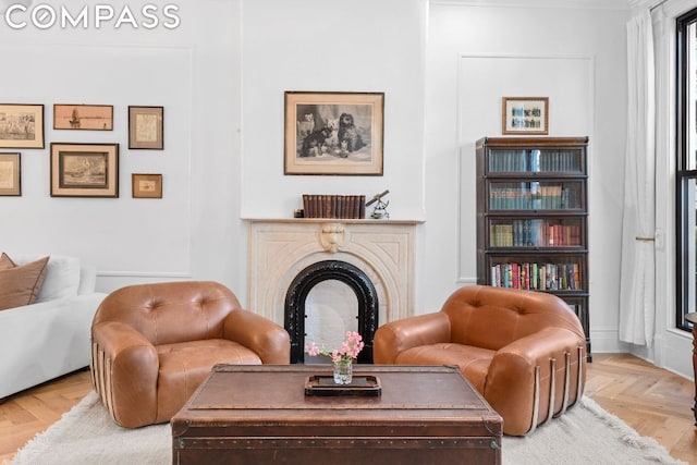 sitting room featuring parquet floors