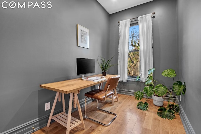 office space with light wood-type flooring