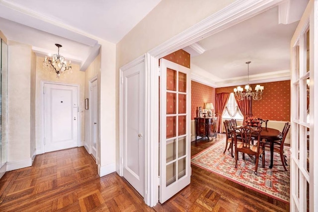 interior space featuring dark parquet floors and a notable chandelier