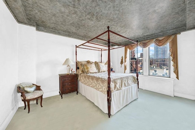 bedroom featuring concrete flooring