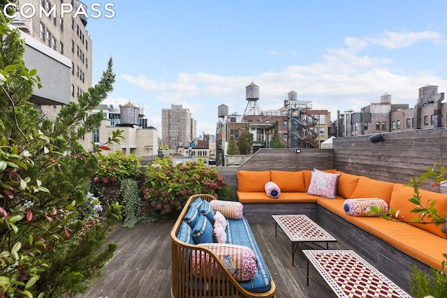 wooden terrace featuring outdoor lounge area