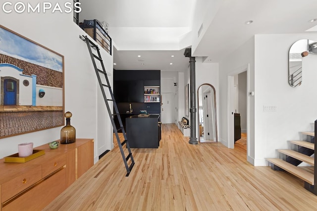 hall with light hardwood / wood-style floors