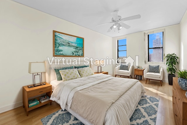 bedroom with light wood-type flooring and ceiling fan