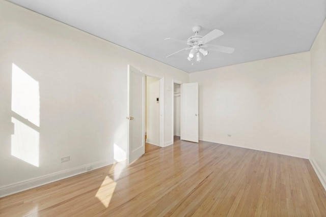 unfurnished room featuring ceiling fan and light hardwood / wood-style floors