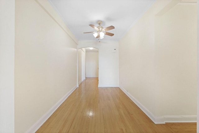 hall with crown molding and light wood-type flooring