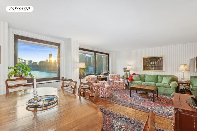 living room with parquet floors and a water view