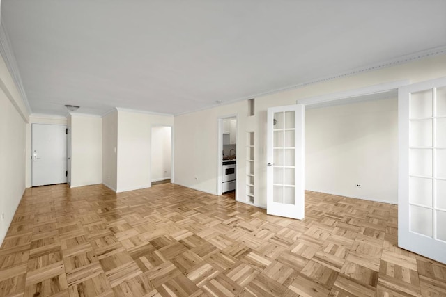 interior space featuring light parquet flooring, crown molding, and french doors