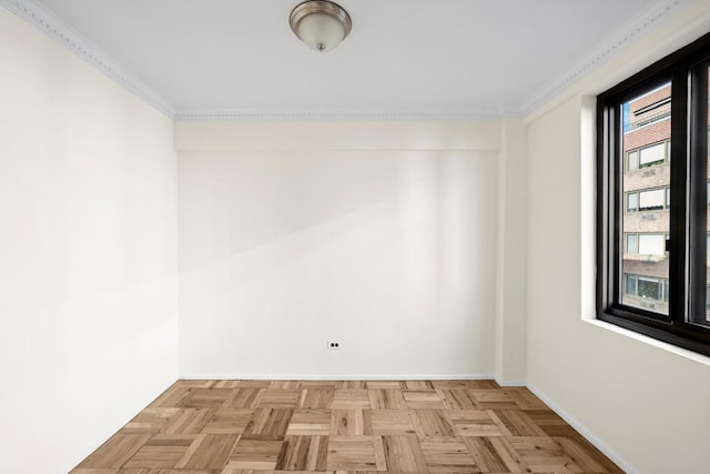 unfurnished room featuring light parquet flooring and crown molding