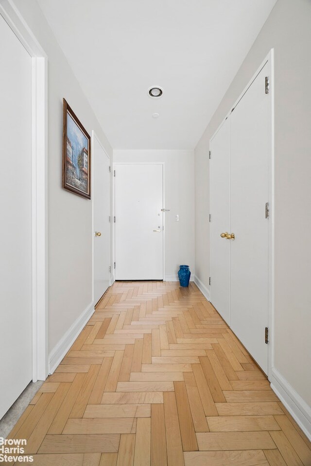 living room with parquet floors and a notable chandelier