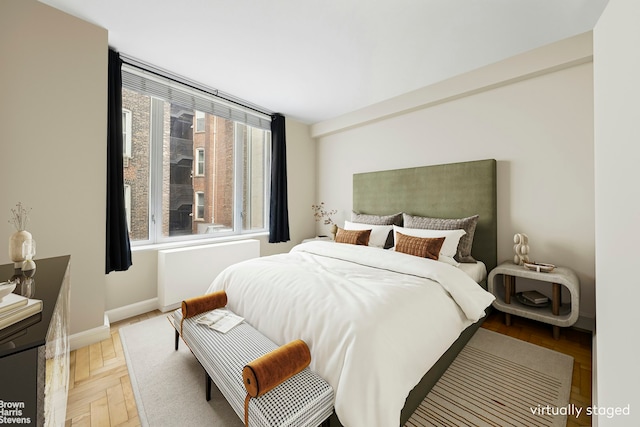 bedroom featuring baseboards