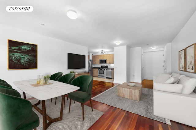 living room featuring visible vents and dark wood finished floors