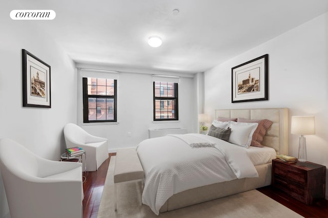 bedroom featuring wood-type flooring and visible vents