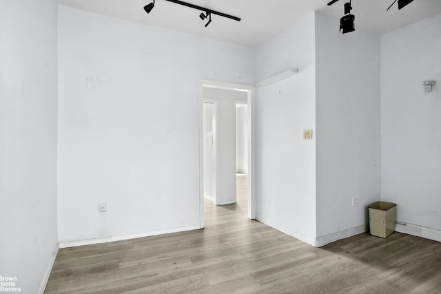 unfurnished room with light hardwood / wood-style flooring