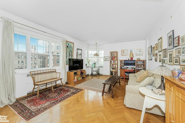 living room featuring parquet flooring