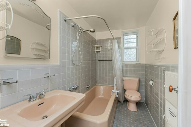 full bathroom with toilet, shower / bath combination with curtain, tile walls, tile patterned floors, and sink