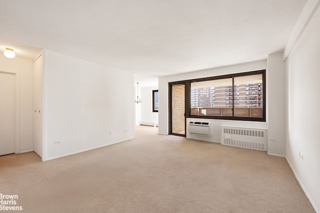 empty room featuring radiator heating unit, light carpet, and a wall mounted air conditioner