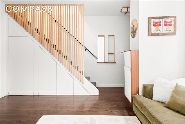 stairway featuring hardwood / wood-style flooring