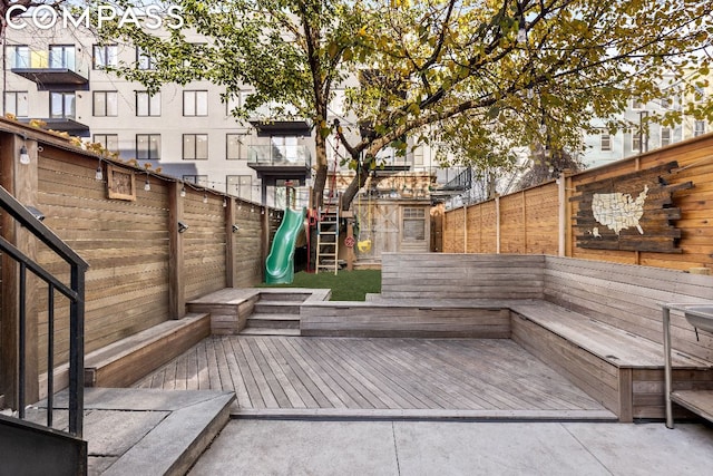 wooden deck with a playground