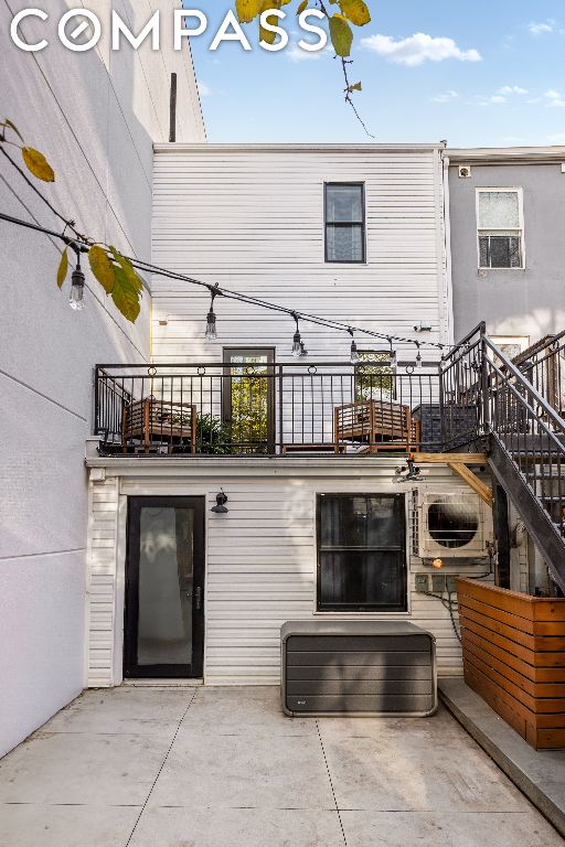 rear view of property featuring a patio area