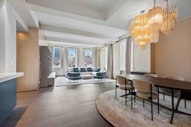 interior space with a notable chandelier and hardwood / wood-style flooring