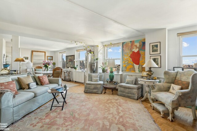 living room featuring plenty of natural light and light parquet floors