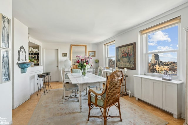 dining room with light parquet floors