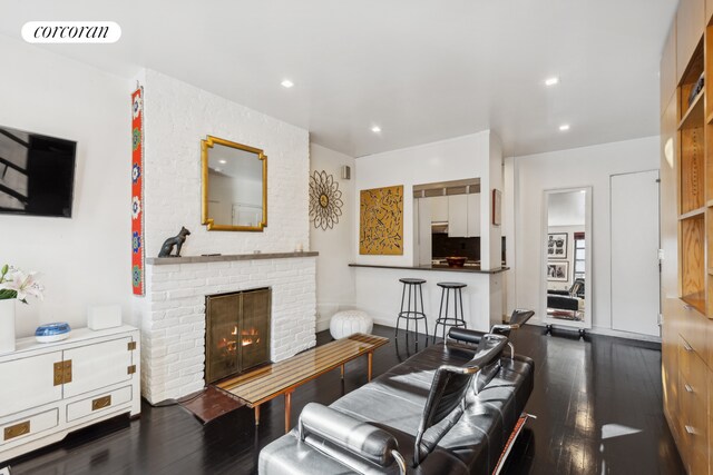 kitchen with white cabinetry, white appliances, dark wood-type flooring, and backsplash