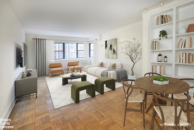 living room with light parquet flooring and built in features